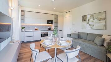 Apartment, 2 Bedrooms, Balcony, Mountain View | Living area | 32-inch TV with cable channels