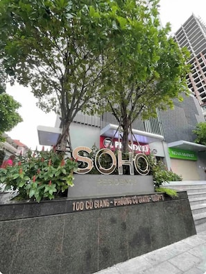 A residential building named 'SOHO' with a sign indicating '100 CO GIANG - PHUONG CO TIEN - QUAT'. - 3BR/4Beds | 2BA • Central D1 • Group Stay • Corner (Thành phố Hồ Chí Minh)