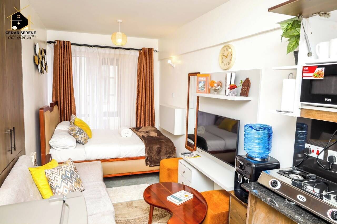 Deluxe-Studio, Stadtblick | Wohnbereich | 32-Zoll-Smart-TV mit Digitalempfang