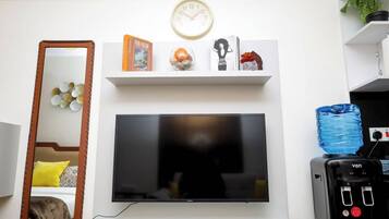 Deluxe Studio, City View | Living area | 32-inch Smart TV with digital channels
