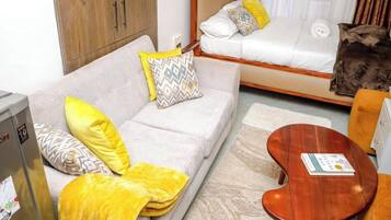 Deluxe Studio, City View | Living area | 32-inch Smart TV with digital channels