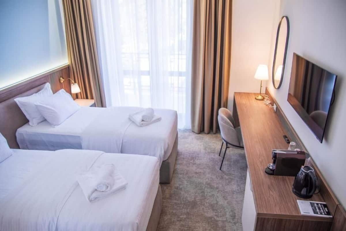 Standard Twin Room, Balcony, City View | In-room safe, desk, laptop workspace, soundproofing