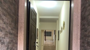 A hallway with a marble floor leading to a staircase. - B&B Sant'oronzo Turi (Turi)