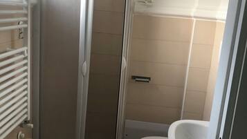 Combined shower/tub, hair dryer, towels, soap