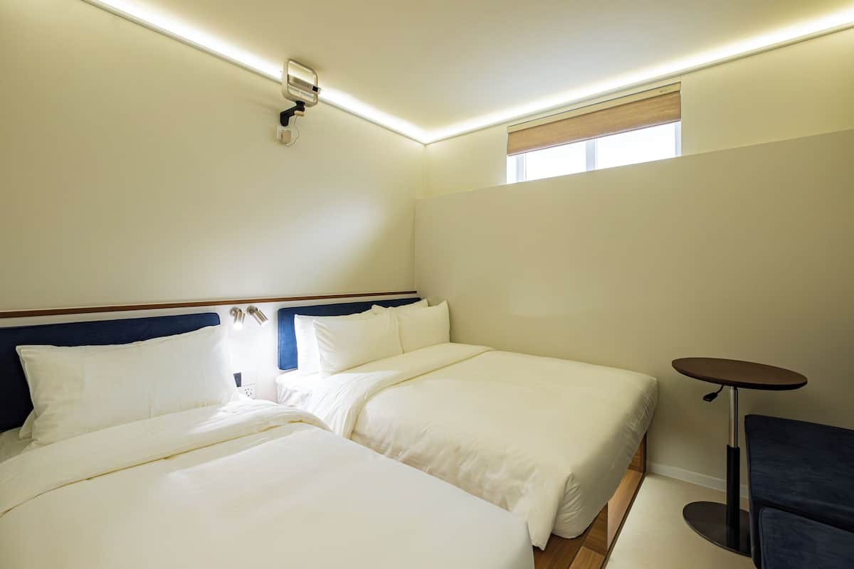 Habitación familiar | Minibar, caja de seguridad en la habitación, wifi gratis y ropa de cama