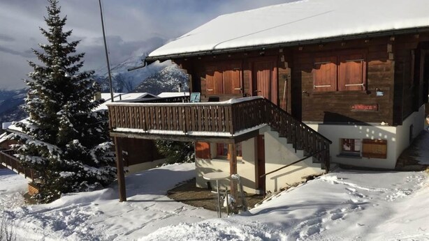 A wooden chalet with a balcony and a staircase leading to the entrance. - Chalet Allegra Appartement/Fewo, Dusche, WC 4-Bettwohnung Erdgeschoss by Interhome (Rosswald)