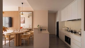 A modern kitchen with a central island, wooden dining table, and pendant lighting. - Stay Together | 5BRs/4BA on Same Floor for Groups (Thành phố Hồ Chí Minh)