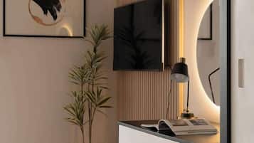 Un espace de bureau moderne comprenant un bureau, une chaise et un grand écran.