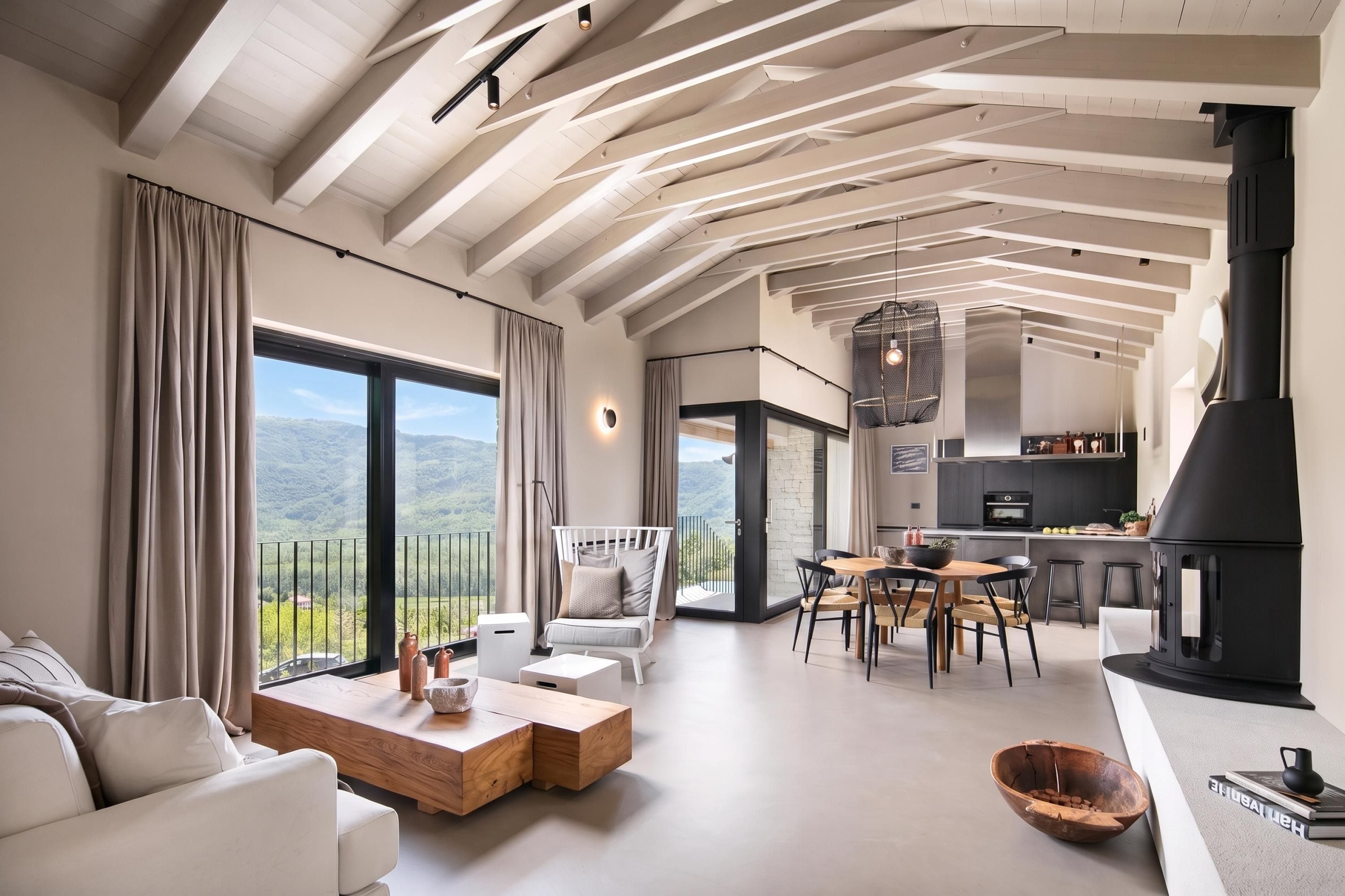 Een moderne woonkamer met een open haard, eethoek en keuken.
