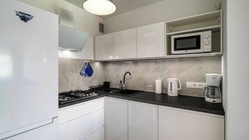 Apartamento, sacada | Cozinha americana privada