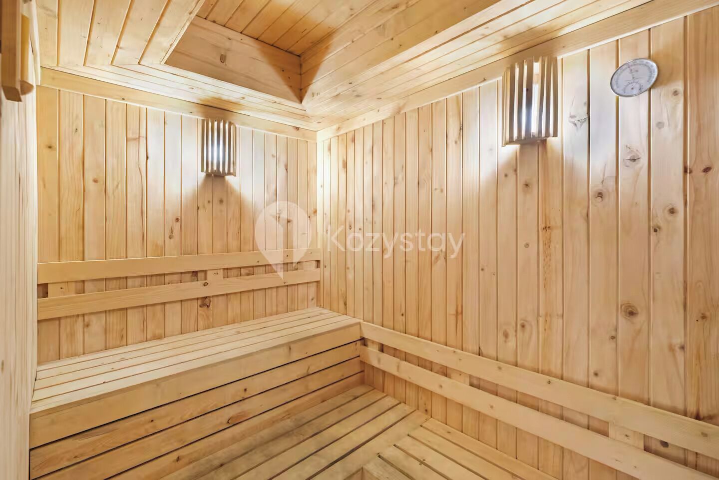 A sauna with wooden walls and benches.