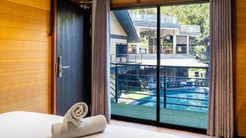 Deluxe Double Room, Pool View | In-room safe, desk