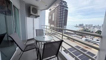 Family Suite, Partial Sea View | Minibar, in-room safe, desk, laptop workspace