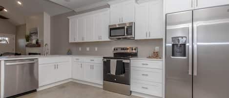 Coffee/tea maker, fridge, microwave, oven
