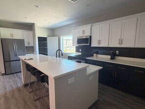 Coffee/tea maker, fridge, microwave, oven