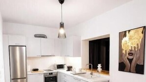 Private kitchen - ALIA Sea & Sunset View Apartment in Kalamaki (Galatas)