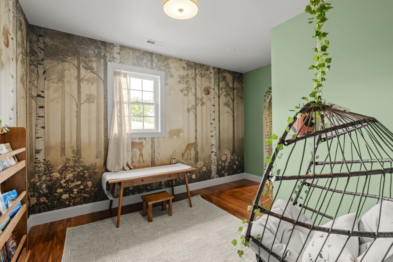 A room with a wooden floor, a window with a curtain, a bookshelf, a small wooden bench, and a hanging plant.