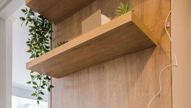 A kitchen with a coffee maker on the counter, a plant on the shelf, and a window with a view. - Beautiful 2BR Apt in Las Condes with Pool & Views (Las Condes)