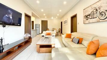 Luxury Apartment, Balcony, City View | Living area | 32-inch Smart TV with digital channels