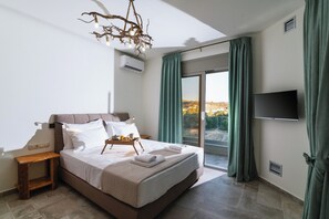 A bedroom with a bed, a bedside table, a tray with breakfast, a TV, and a view through a sliding door. - Villa Okalia – Private Pool, 100m from Kalamaki Beach (Kalamaki)