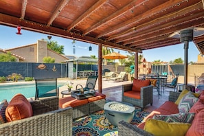An outdoor patio with wicker furniture, a pool, and a barbecue area. - Yuma Desert Oasis w/ Private Pool & Home Gym! (Yuma)