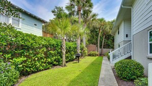 A well-maintained residential lawn with a pathway leading to a wooden deck. - Walk to Beach! Atlantic Beach Extended Stay (Atlantic Beach)