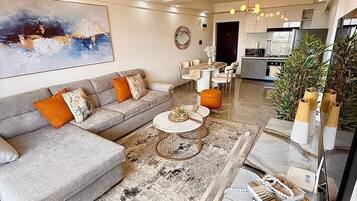 Family Apartment, Balcony | Living area | 32-inch Smart TV with digital channels