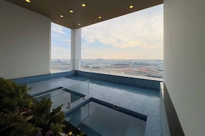 A rooftop infinity pool with a clear view of the cityscape. - Vogue, Arjan Skyz by Danube near Dubai Miracle Garden (Arjan)