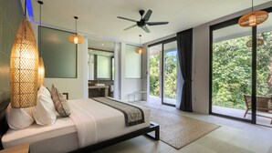 A modern bedroom with a bed, bedside lamps, a ceiling fan, and a view of the outdoors. - Lula Boutique by The Studios Ubud  (Ubud)