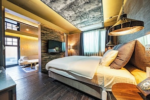 A modern hotel room with a large bed, a flat-screen TV, a wooden ceiling, and a view of the outdoors. - Hotel Parkview (Seoul)