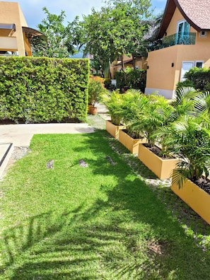 A well-maintained garden with a variety of plants and a neatly trimmed lawn.