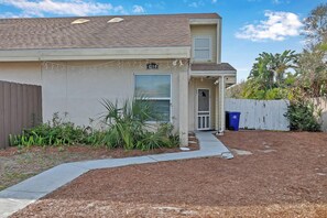 A residential property with a single-story structure, a front porch, and a mailbox. - Seagate Escape condo w. Beach Access (St Augustine)