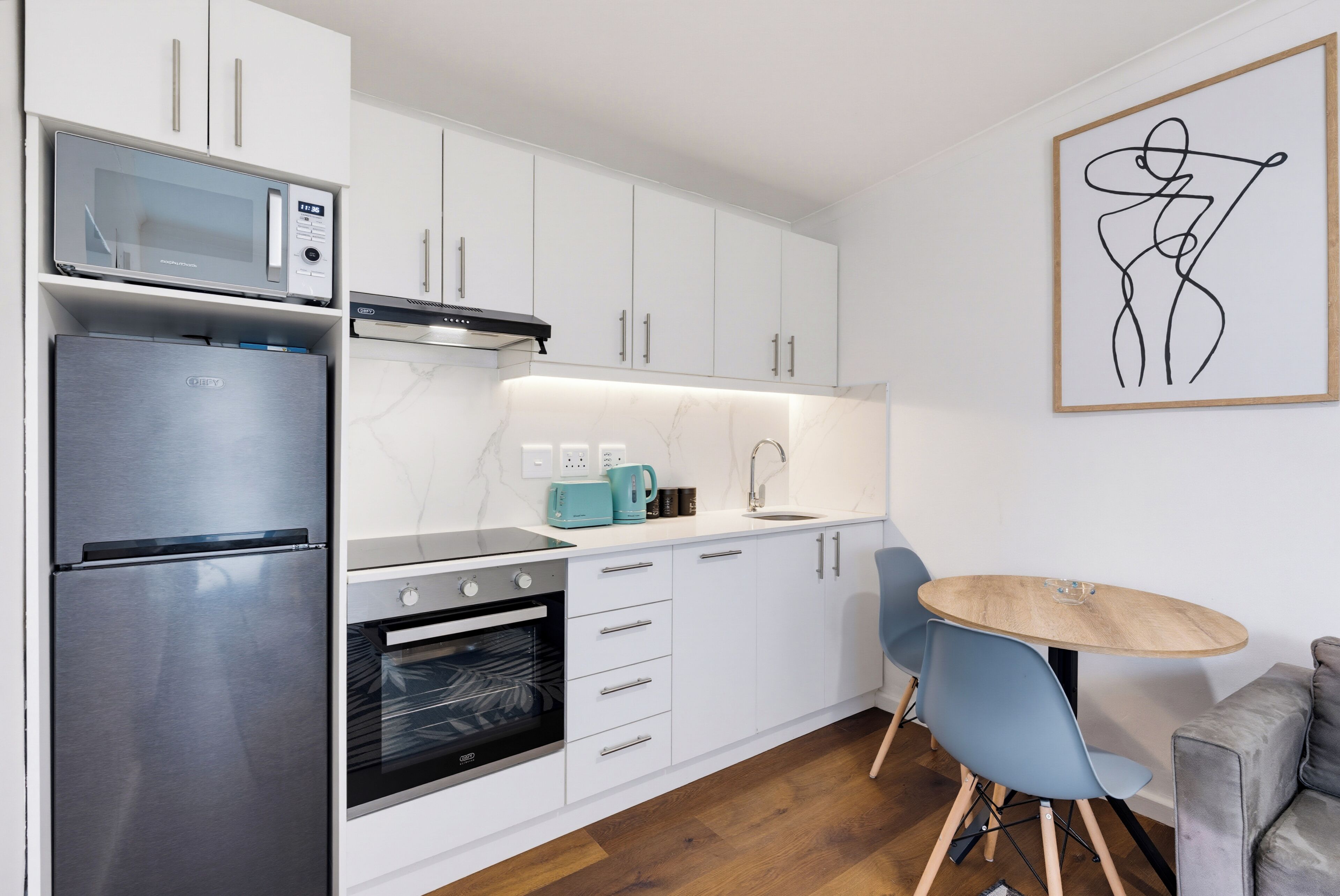 Coffee/tea maker, fridge, microwave, oven