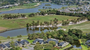 A residential area with houses, a golf course, and a lake. - The Sawgrass Sanctuary (PONTE VEDRA BEACH)