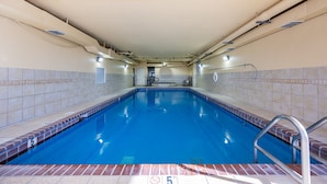 A swimming pool with a 5 FT depth marker, tiled walls, and a ceiling with visible HVAC ducts. - Phoenix Iv 4085 3 Bedroom Condo (Orange Beach)