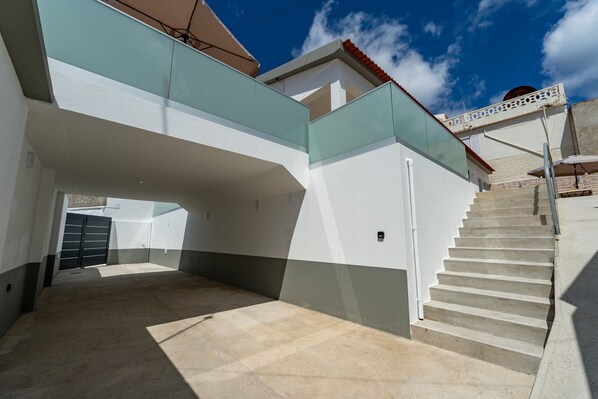 A modern building with a staircase leading to a second floor.