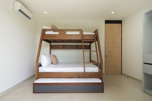 A bunk bed with a ladder, white bedding, and a wooden headboard. - Casa Joanna | Luxury Jungle Retreat in Pacifico Resort | Private Pool (Pacifico Resort Lot 35)