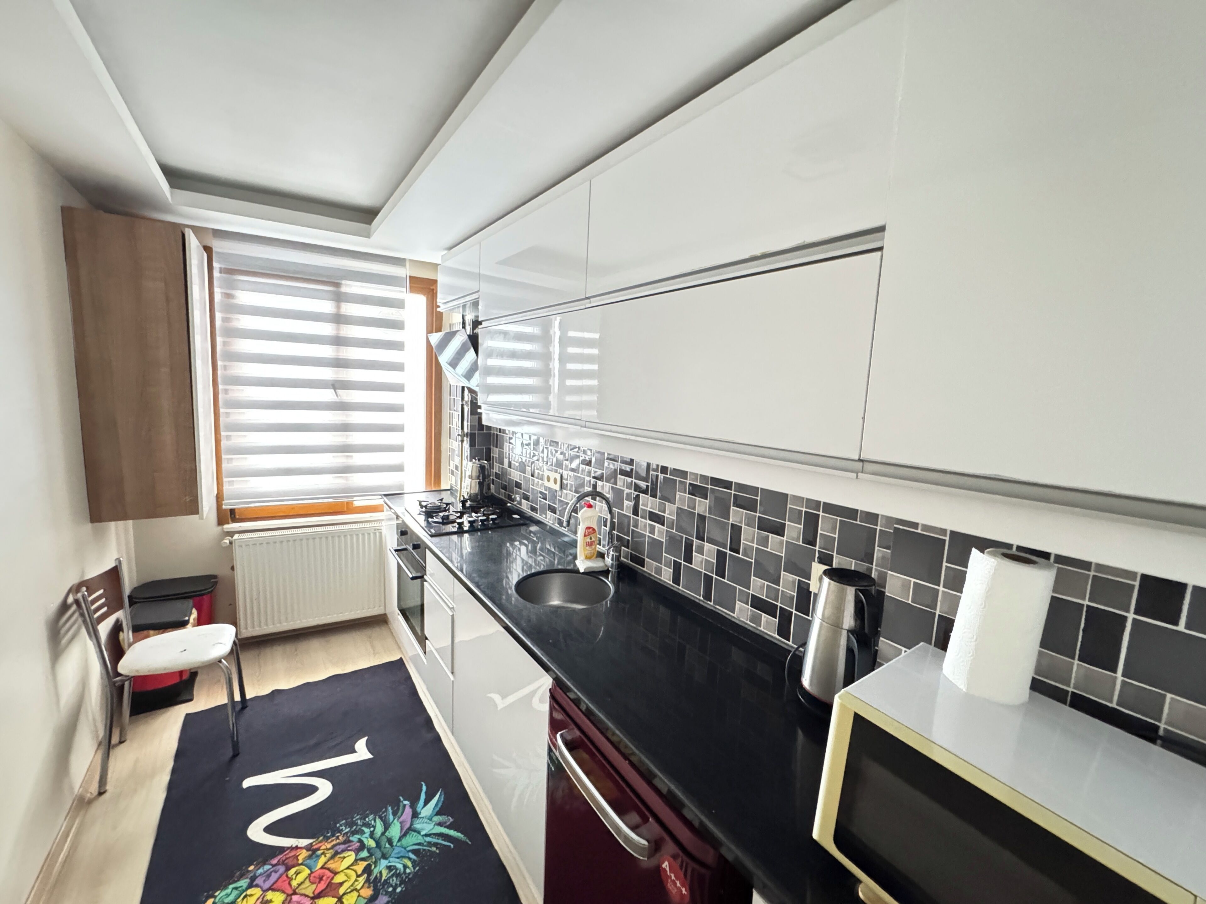 Luxe Twin kamer, balkon, uitzicht op de stad | Privékeuken | Een kookplaat