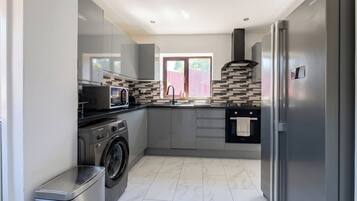 Coffee/tea maker, fridge, microwave, oven
