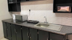 Family Room, River View | Private kitchen