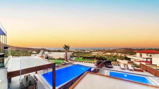 A rooftop pool area with a view of the sea and surrounding landscape. - Kamelia Luxury Villa 2 (Hersonissos)