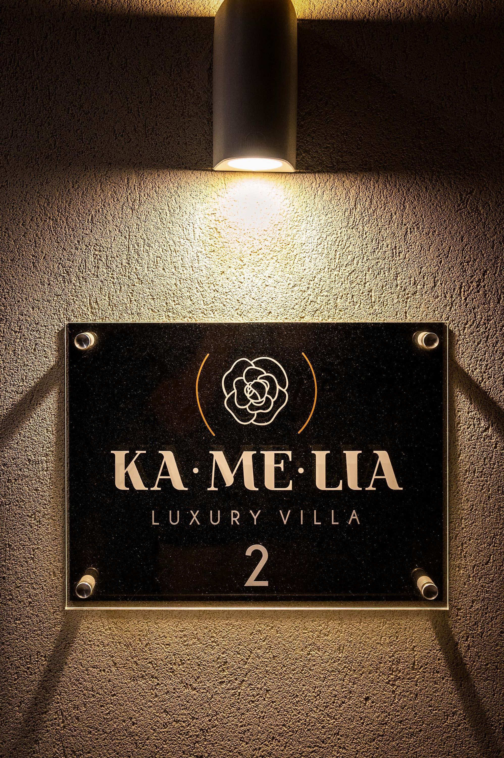 A sign for 'KA. ME. LIA LUXURY VILLA' with a number '2' indicating its location.