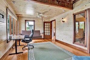 A wooden interior with a desk, chair, sofa, and a ceiling fan. - "Catican Bayou" Fish River Waterfront Home 3 bedrooms; 5 bathrooms  Kayaks (Summerdale)