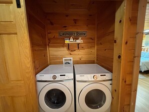 A laundry room with two Samsung washing machines and a sign above them. - 5BR Pool Cabin w/MTN Views! Hot Tub*Games*Zipline! (Sevierville)