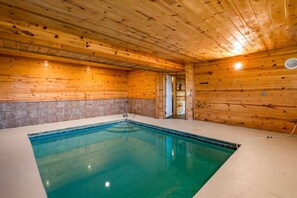 A wooden cabin with a pool. - 5BR Pool Cabin w/MTN Views! Hot Tub*Games*Zipline! (Sevierville)