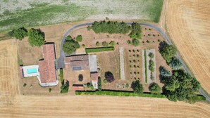 An aerial view of a property with a swimming pool, multiple buildings, and a large field. - So Villa Chez Penet (16) - Outdoor Pool - Beach Volleyball - 1 hour from Bordeaux - Sleeps 30. (Berneuil)
