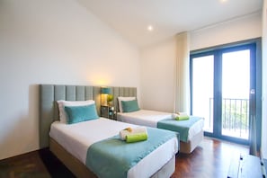 A hotel room with two beds, a balcony, and a view of the outdoors. - Villa w/ Pool & BBQ near Albufeira Marina (Albufeira)