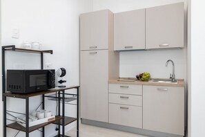 Unclassified image, 5 of 7, button - Cozy 22 sqm studio apartment, for two guests, located on the second floor of a renovated historic building (no elevator). The property enjoys a strategic location just steps away from the Policlinico hospital, the Ballarò district, and the city center;  (Palermo)