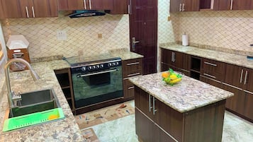 Economy Apartment, Balcony, City View | Private kitchen | Fridge, microwave, oven, stovetop
