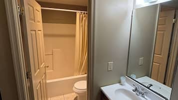 Economy Room, 2 Queen Beds, Non Smoking | Bathroom | Combined shower/bathtub, towels, toilet paper